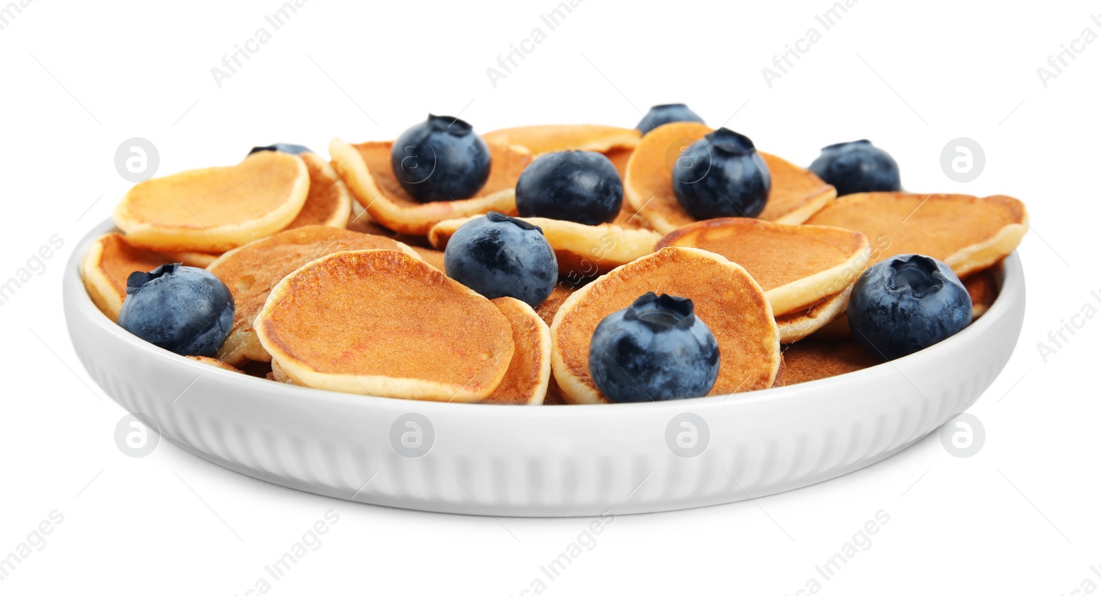 Photo of Delicious mini pancakes cereal with blueberries on white background