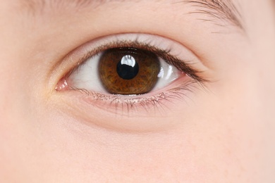Photo of Little girl, focus on eye. Visiting children's doctor and ophthalmologist