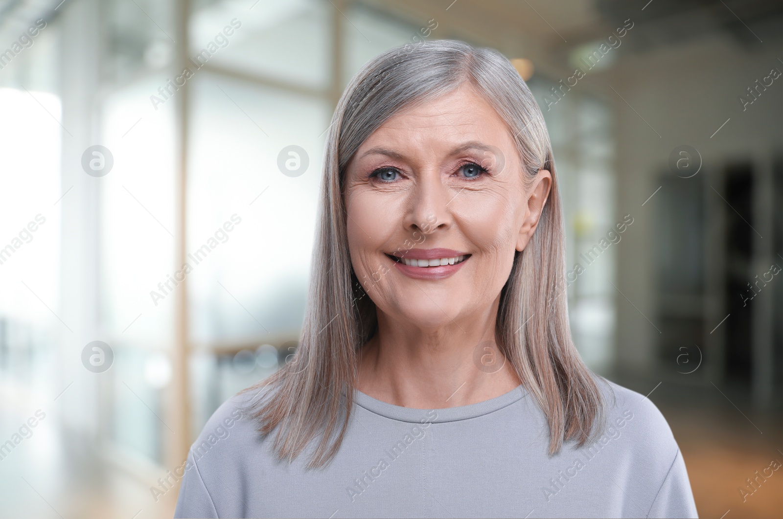 Image of Portrait of confident woman on blurred background