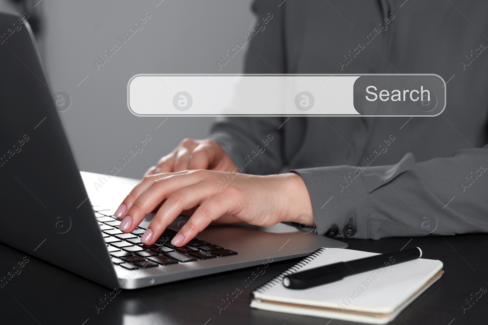 Image of Search bar of website over laptop. Woman using computer at black table, closeup