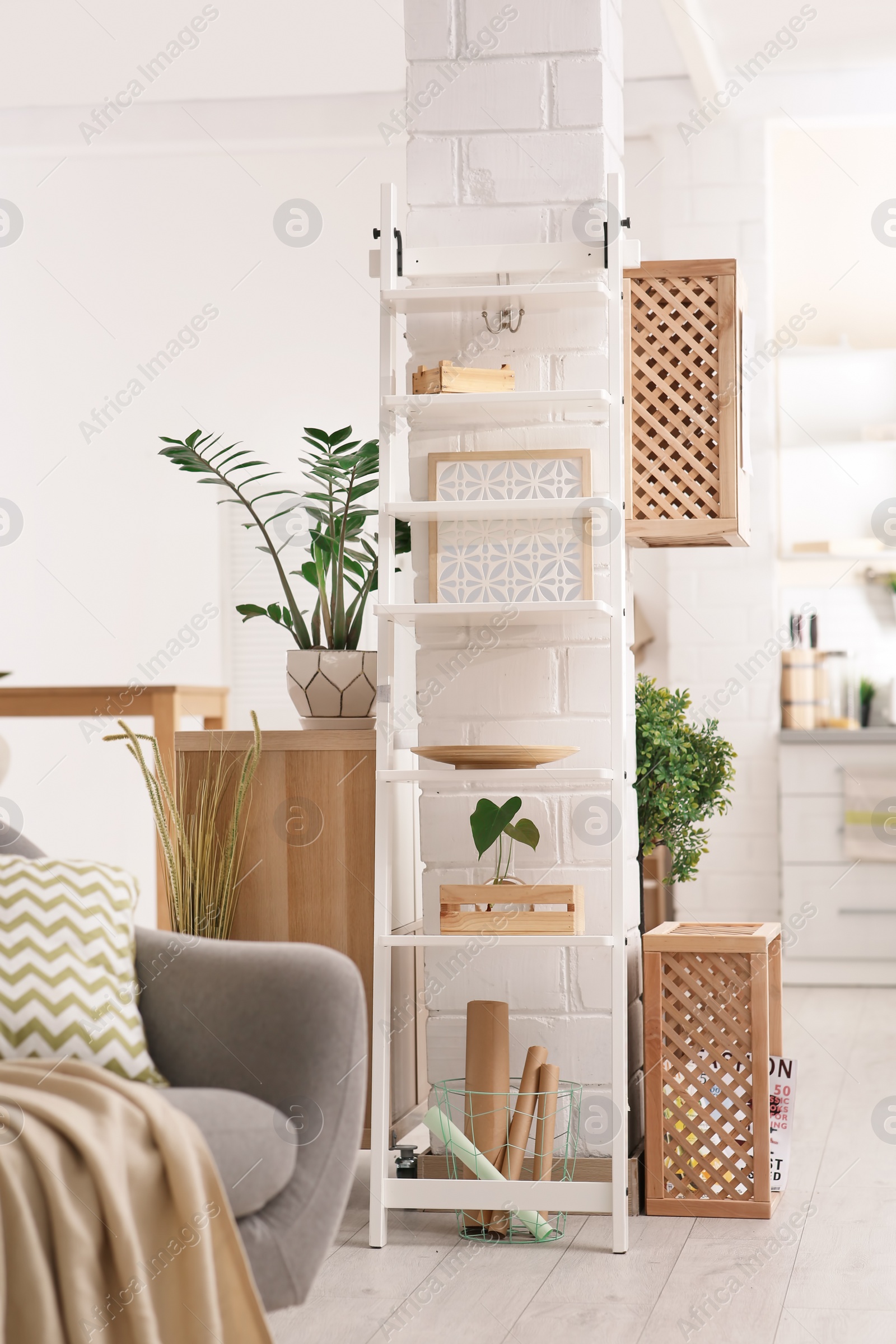 Photo of Modern eco style interior with wooden crates and shelves