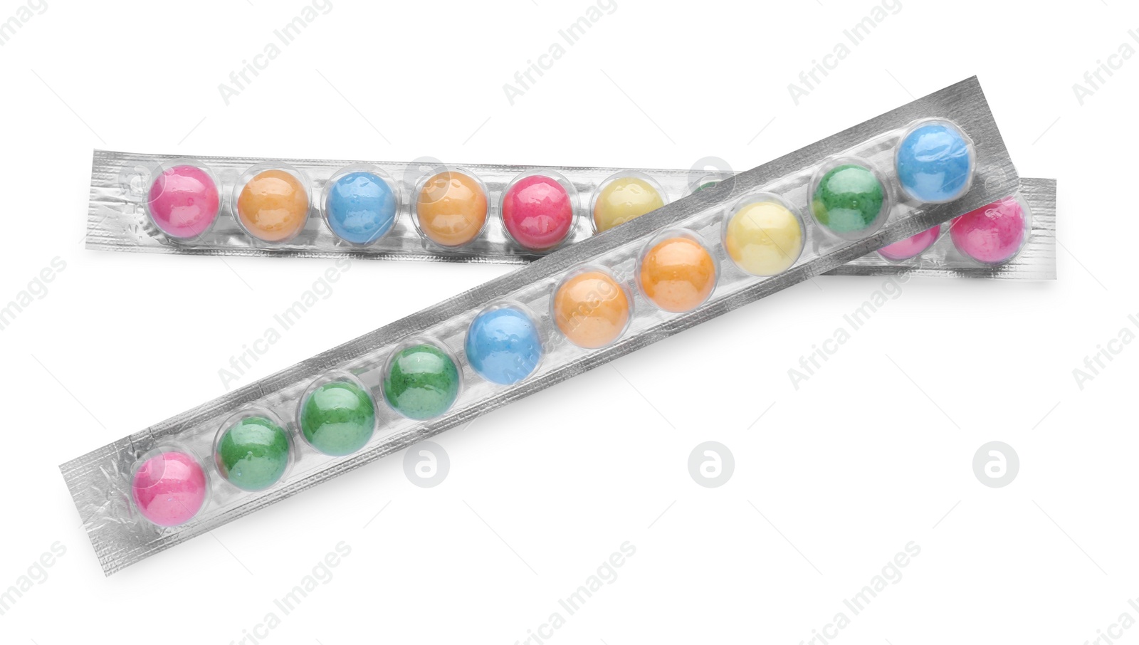 Photo of Packages with many bright gumballs isolated on white, top view