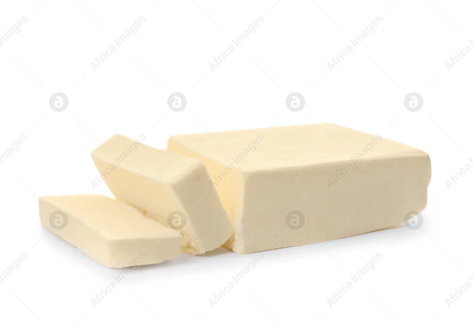 Photo of Tasty fresh cut butter on white background