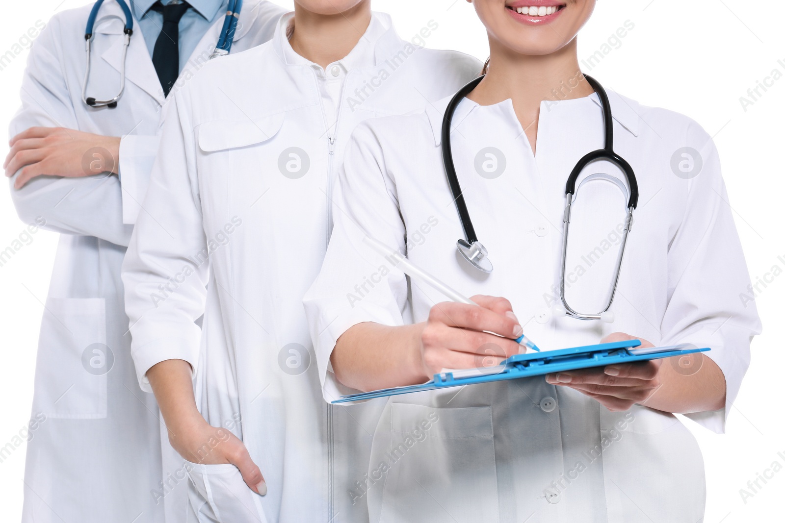 Photo of Doctor with clipboard and colleagues on white background, closeup. Unity concept