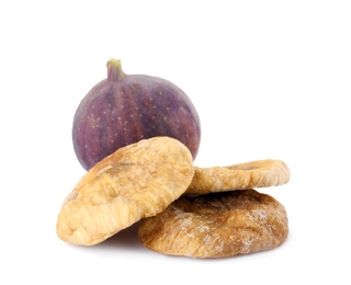 Photo of Tasty dried and raw figs on white background