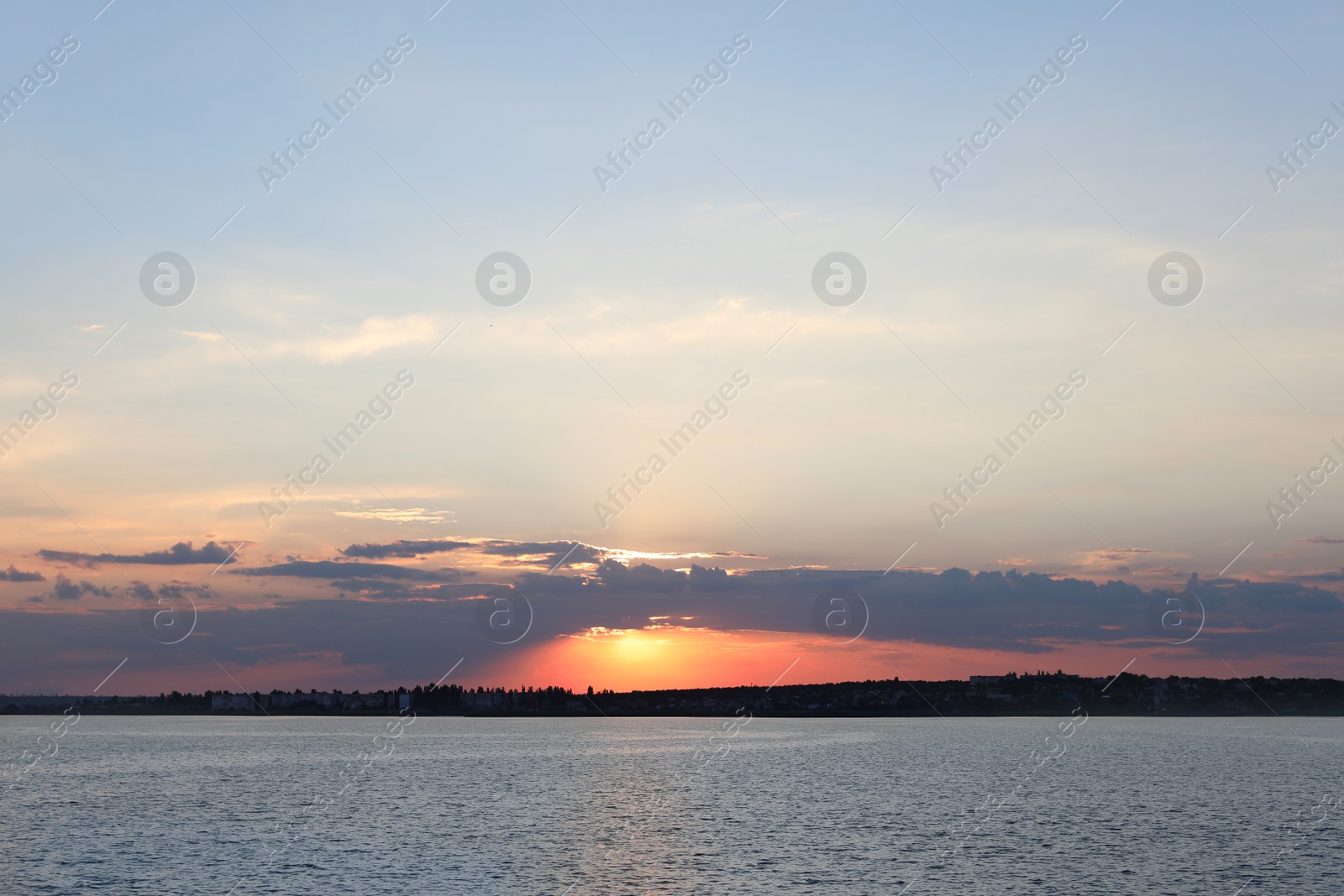 Photo of Picturesque view of beautiful sunrise on riverside. Morning sky