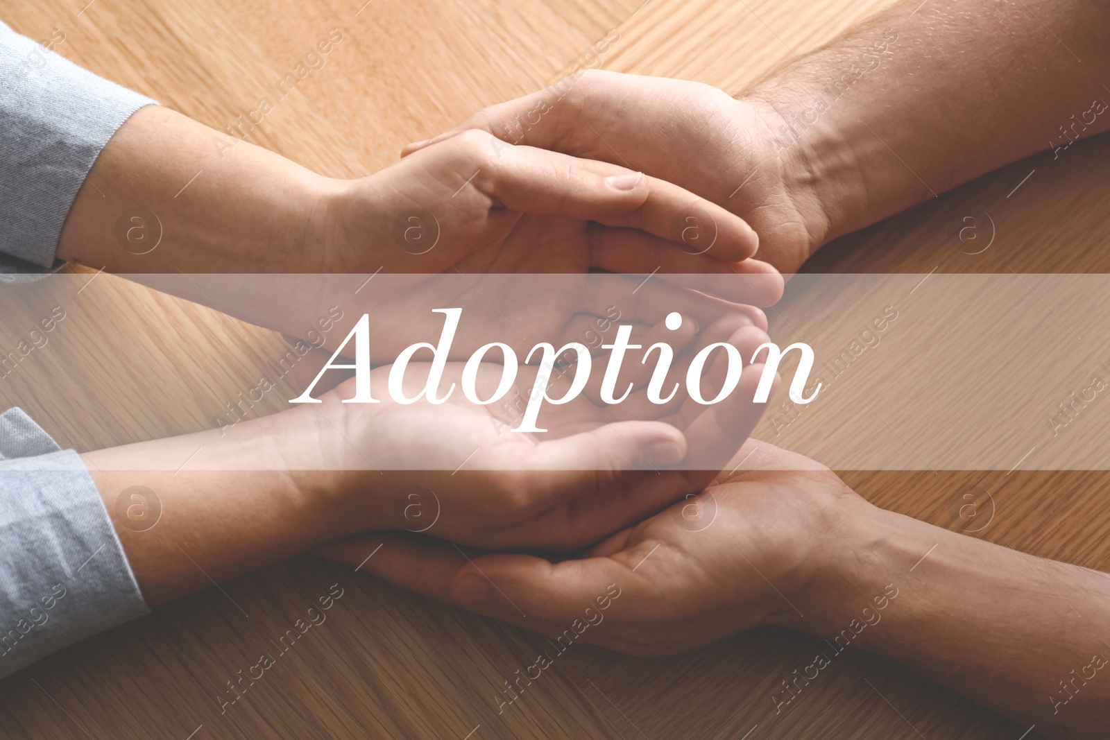 Image of People holding hands on wooden background, top view. Child adoption concept