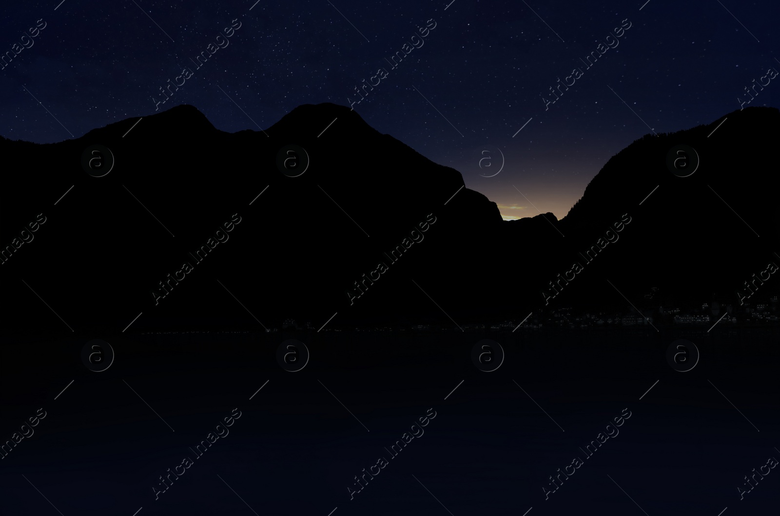 Image of Beautiful view of starry sky over mountains at night