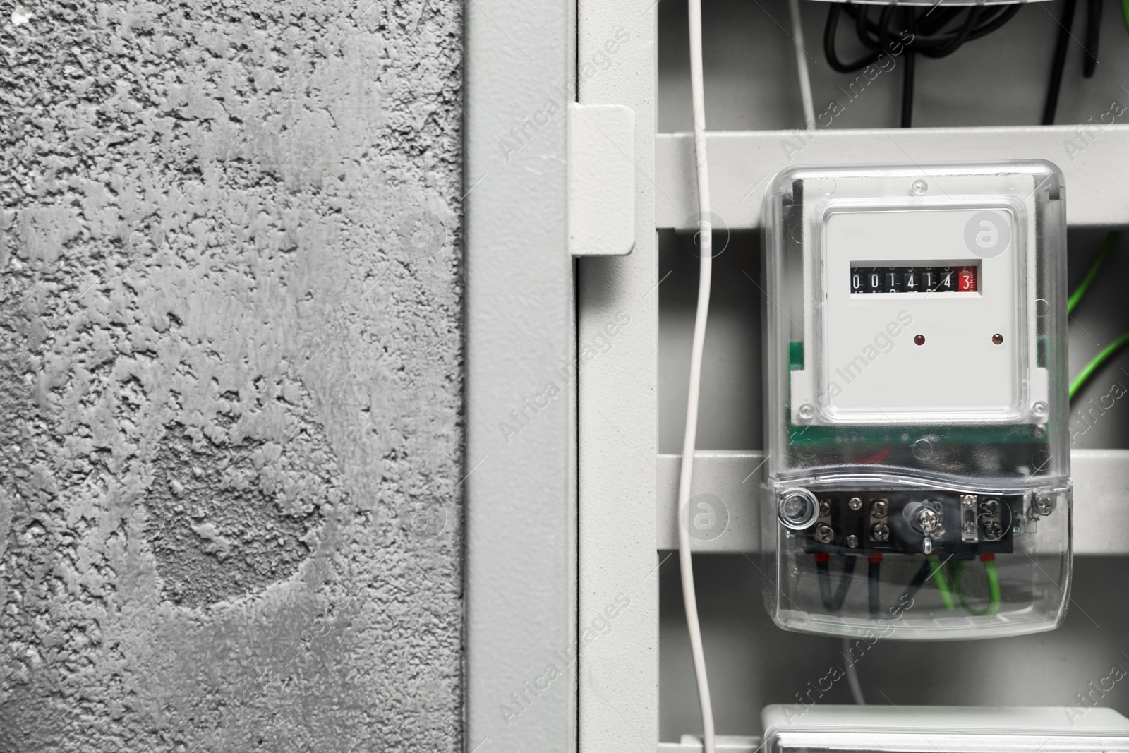 Photo of Electric meter and wires in fuse box, space for text