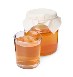 Tasty kombucha in jar and glass isolated on white