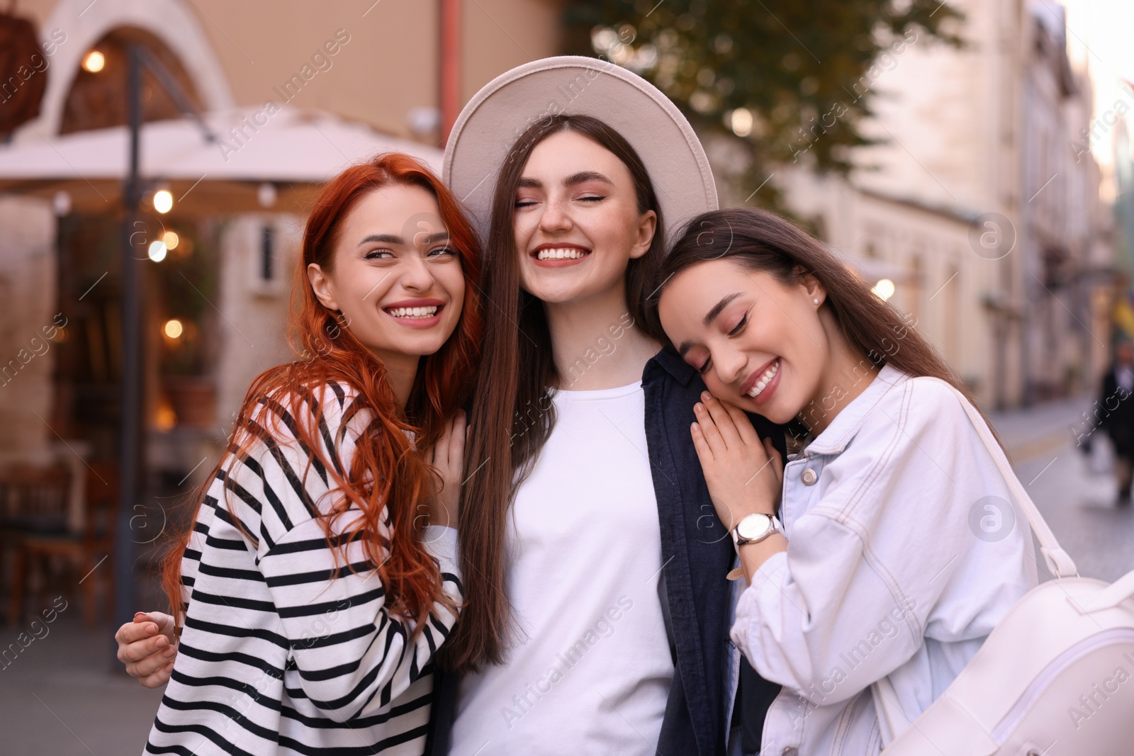 Photo of Happy friends spending time together on city street