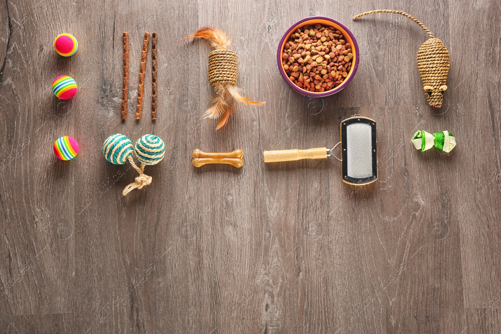 Photo of Flat lay composition with cat accessories and food on wooden background