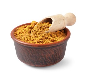 Photo of Curry powder in bowl and scoop isolated on white