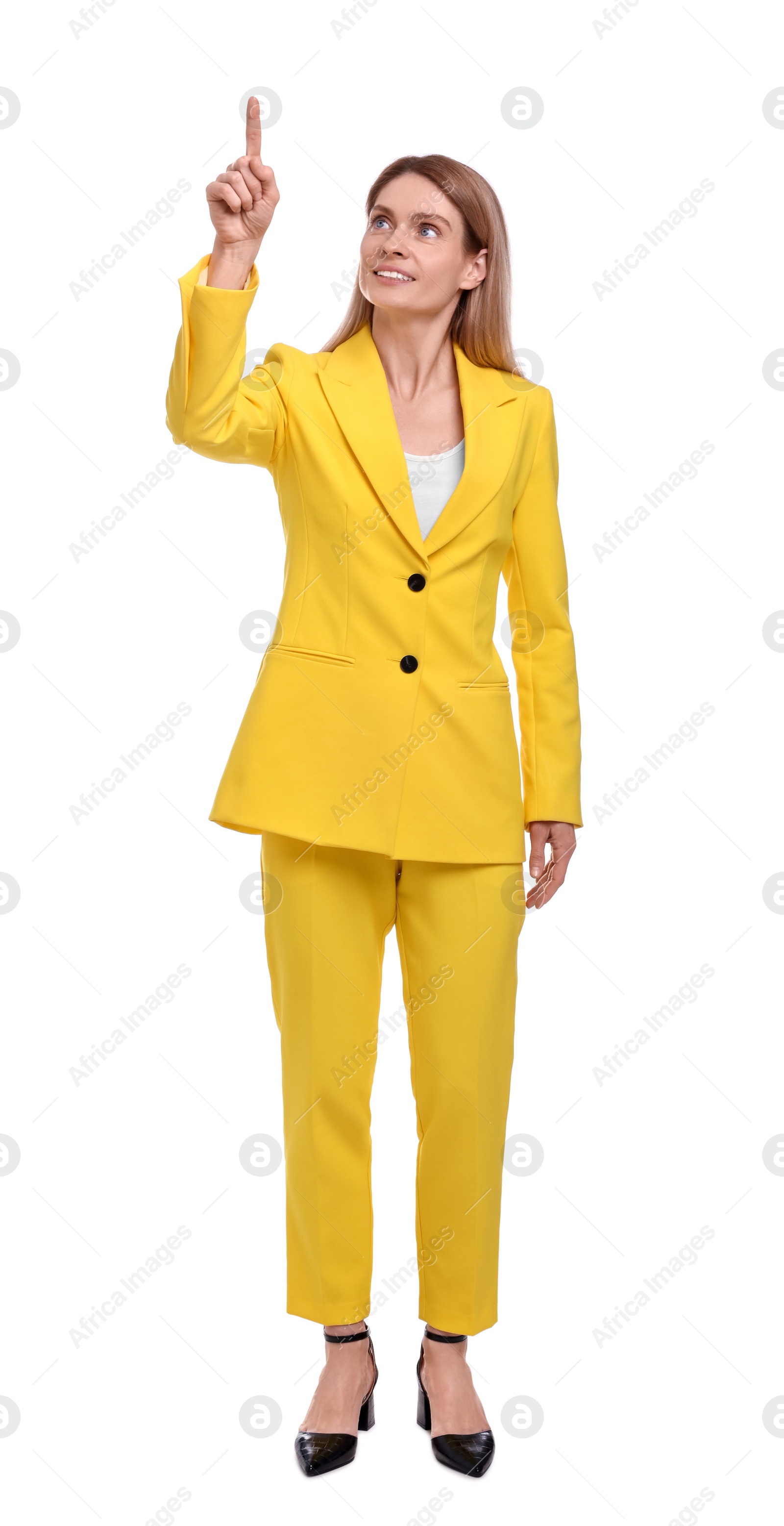 Photo of Beautiful happy businesswoman pointing at something on white background