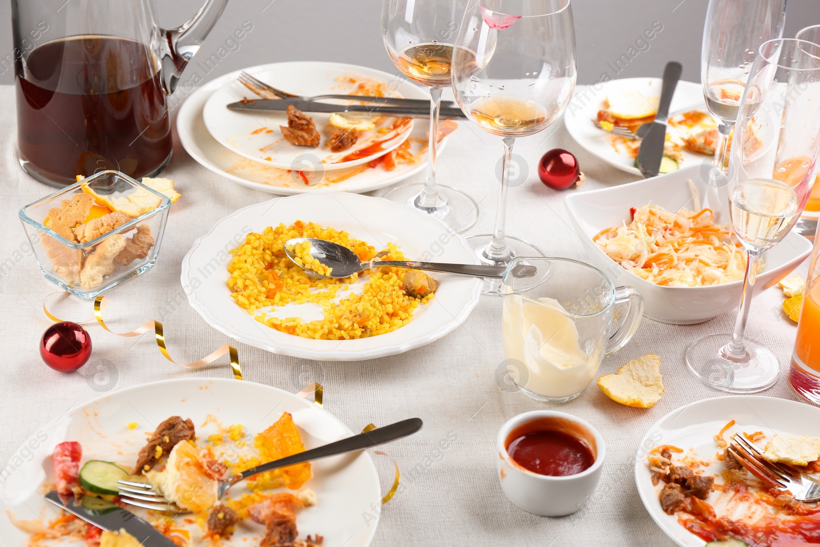 Photo of Food leftovers after party on table with cloth