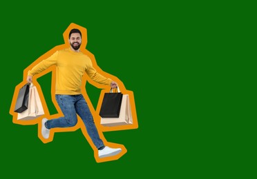 Happy man with shopping bags jumping on green background, space for text