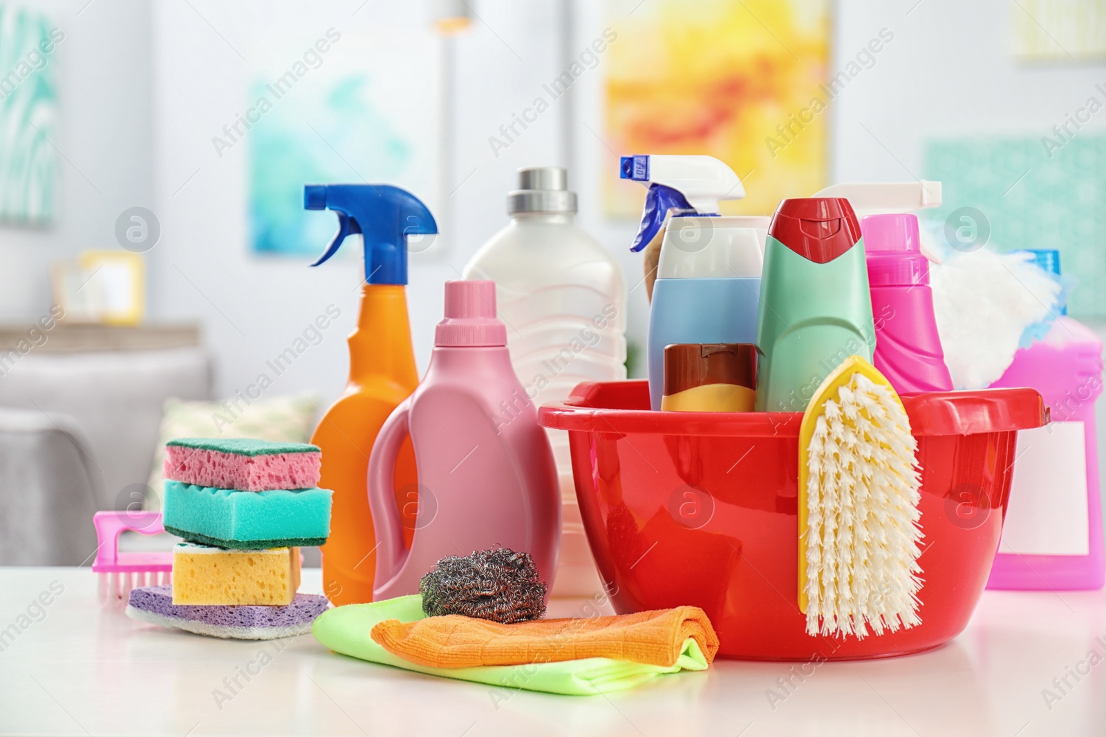 Photo of Set of cleaning supplies on table indoors