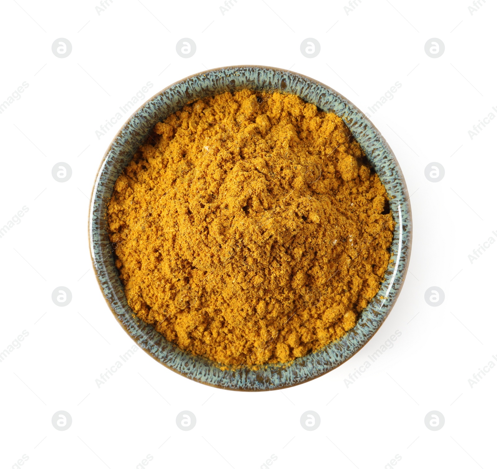 Photo of Dry curry powder in bowl isolated on white, top view