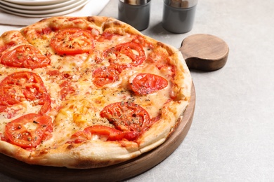 Hot cheese pizza Margherita on grey table