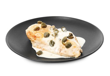 Photo of Delicious chicken fillet with capers and sauce isolated on white