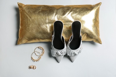 Photo of Flat lay composition with lady's shoes on light background