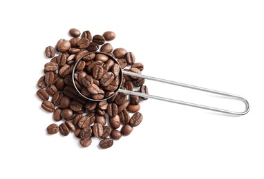 Photo of Scoop and roasted coffee beans on white background, top view
