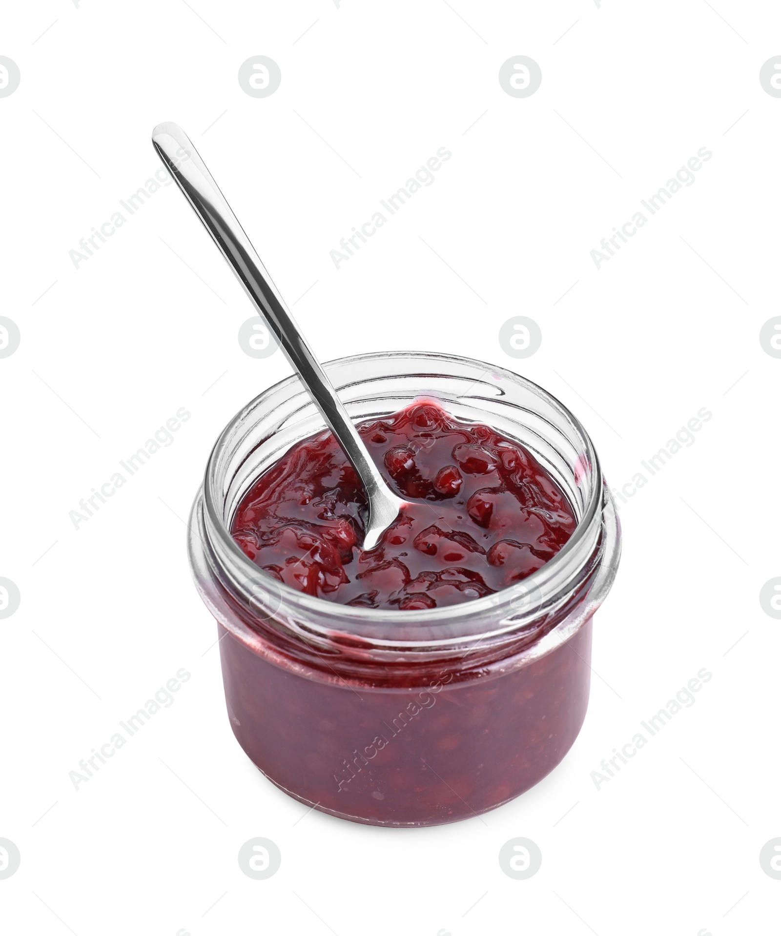 Photo of Fresh cranberry sauce in glass jar and spoon isolated on white