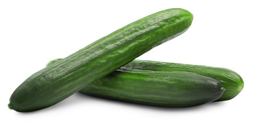 Photo of Three long fresh cucumbers isolated on white