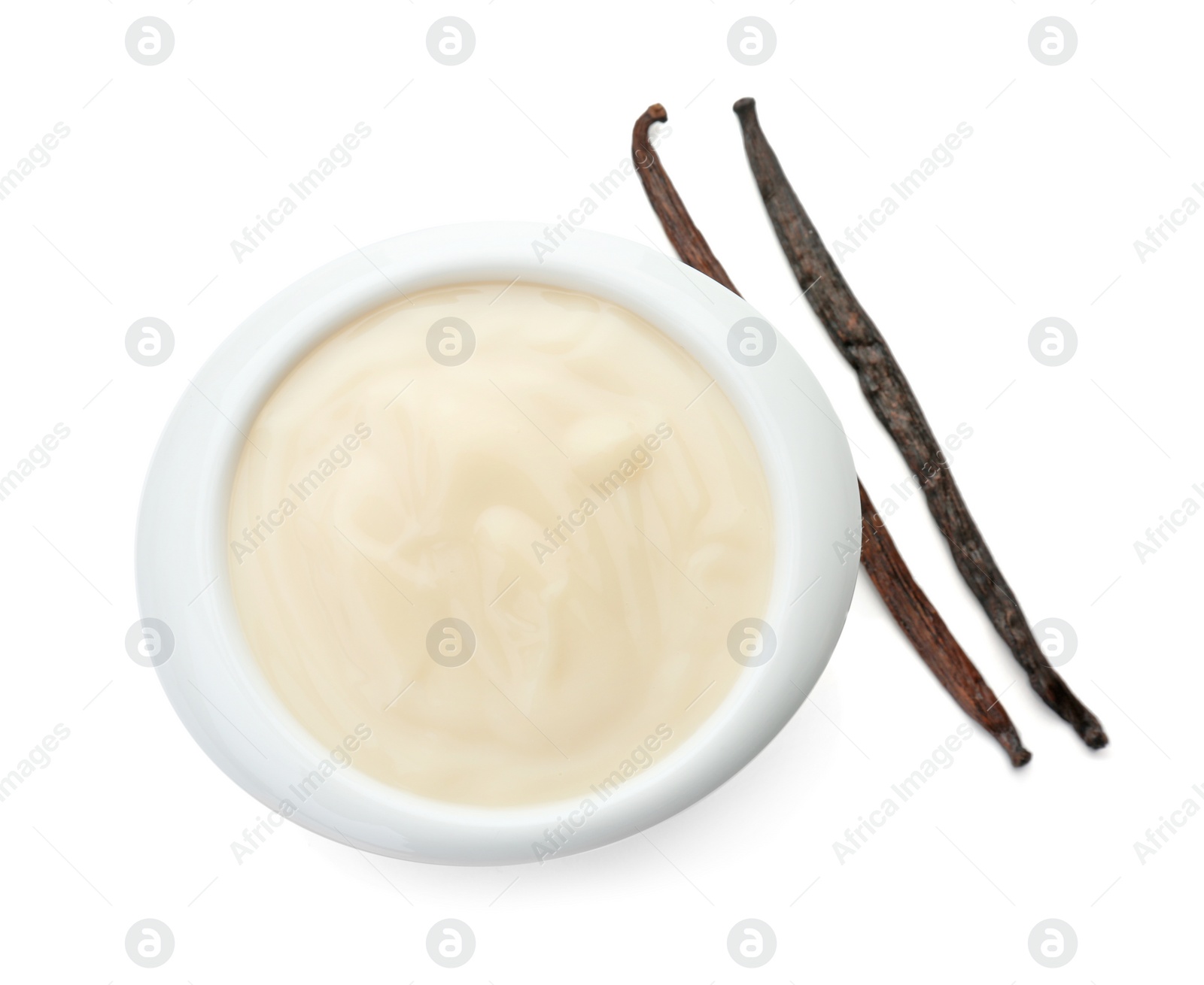 Photo of Vanilla pudding and sticks on white background