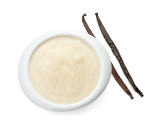 Vanilla pudding and sticks on white background