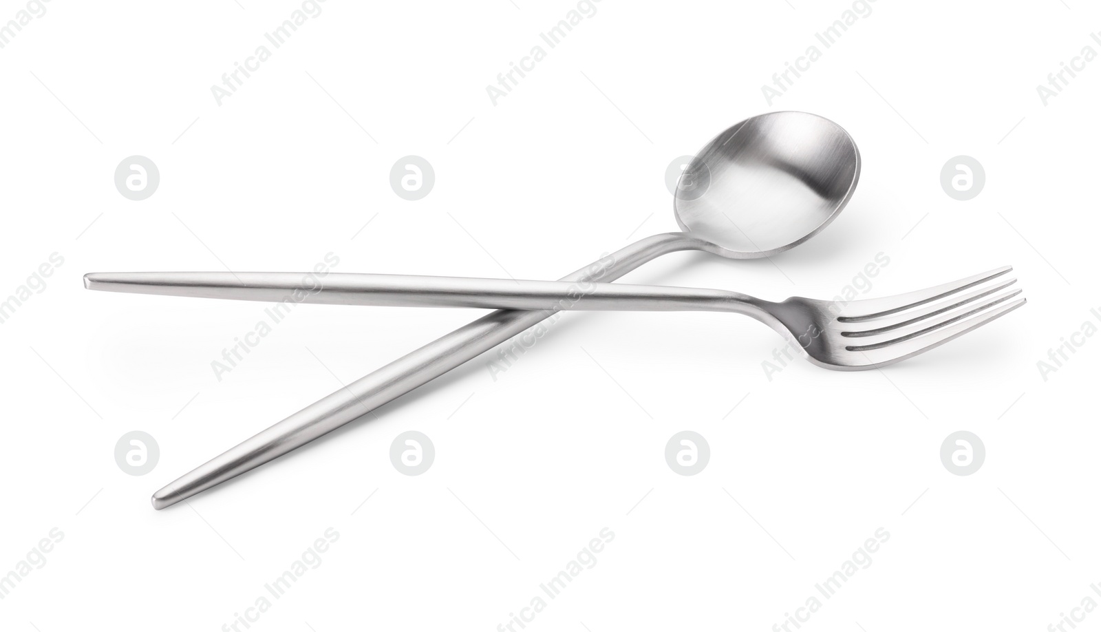 Photo of Shiny silver fork and spoon isolated on white. Luxury cutlery