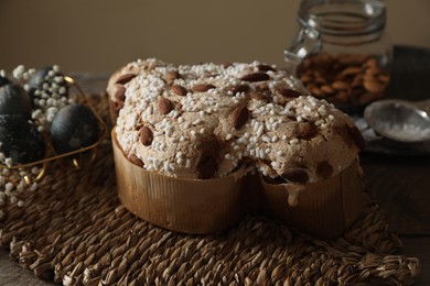 Delicious Italian Easter dove cake (traditional Colomba di Pasqua) on wooden table