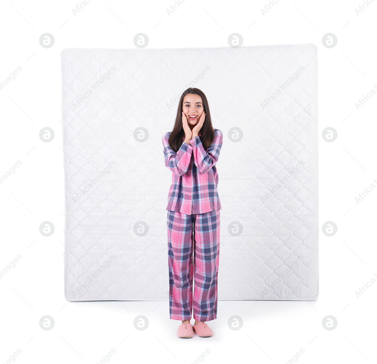 Photo of Young woman with comfortable mattress isolated on white