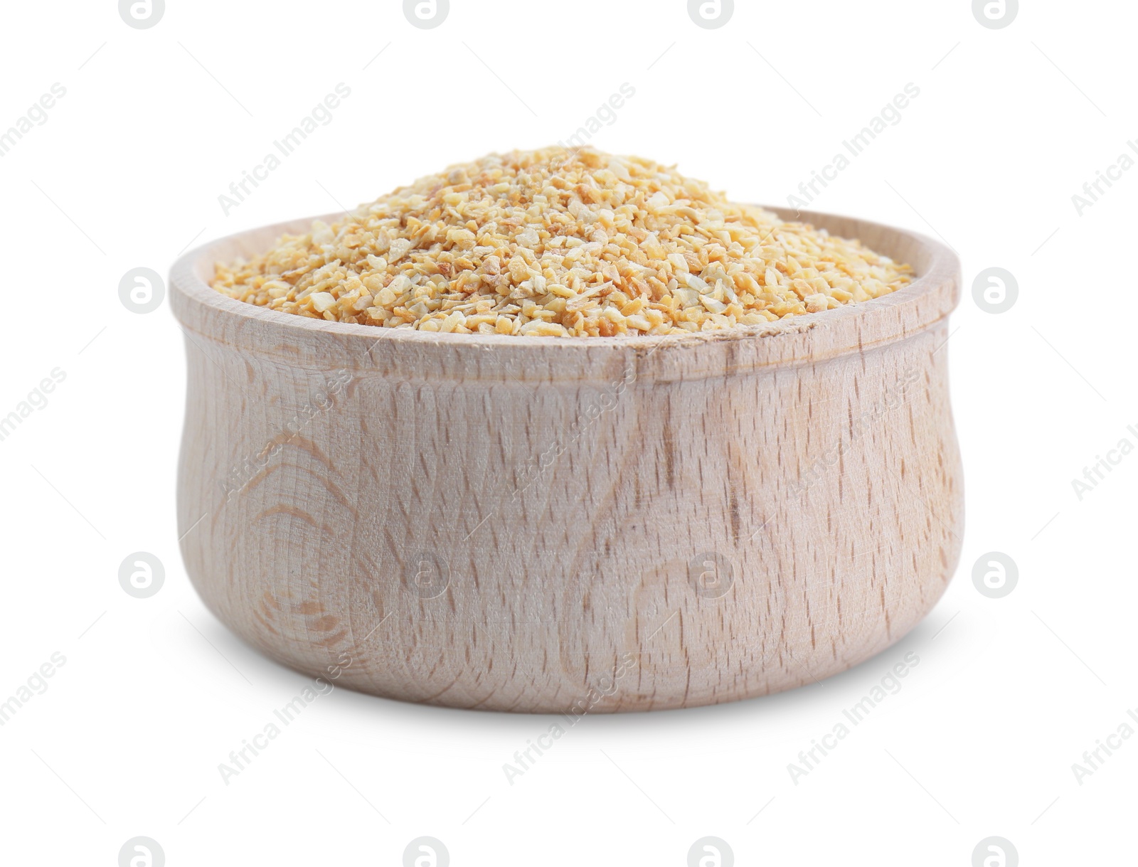 Photo of Dehydrated garlic granules in wooden bowl isolated on white