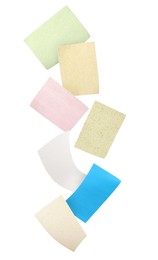 Image of Different facial oil blotting tissues falling on white background. Mattifying wipes