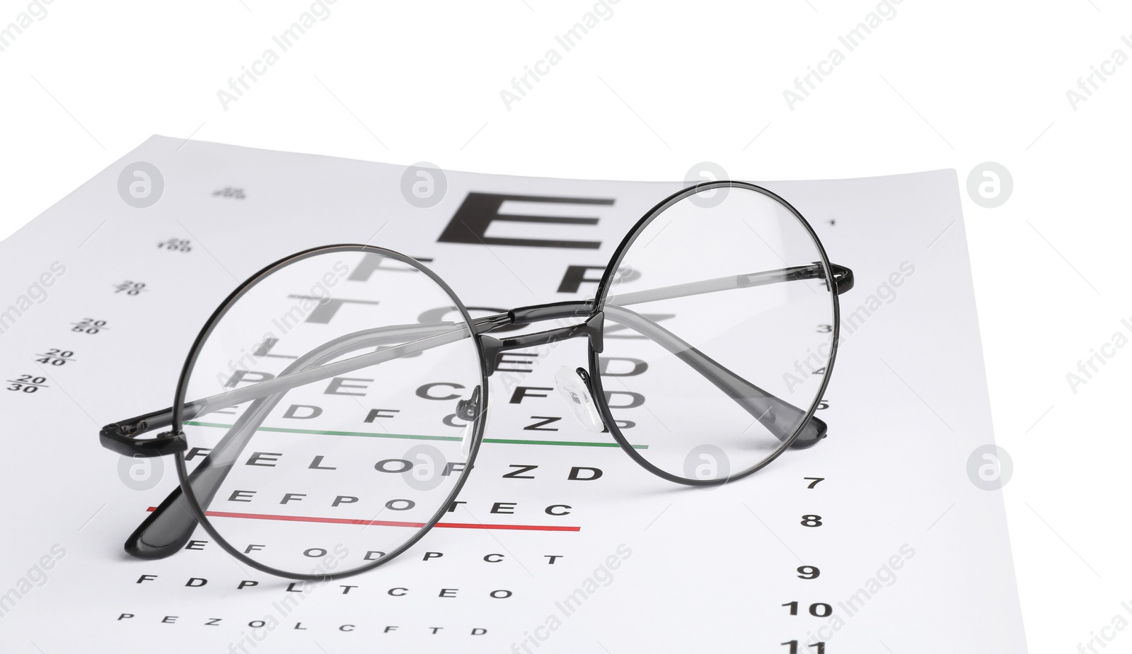 Photo of Glasses and vision test chart isolated on white