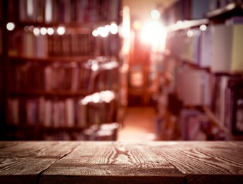 Image of Empty wooden table in library. Space for design 