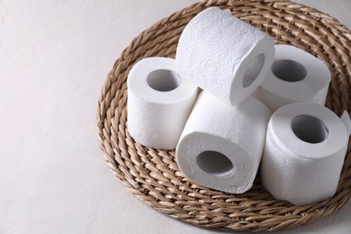 Photo of Toilet paper rolls on white table, space for text