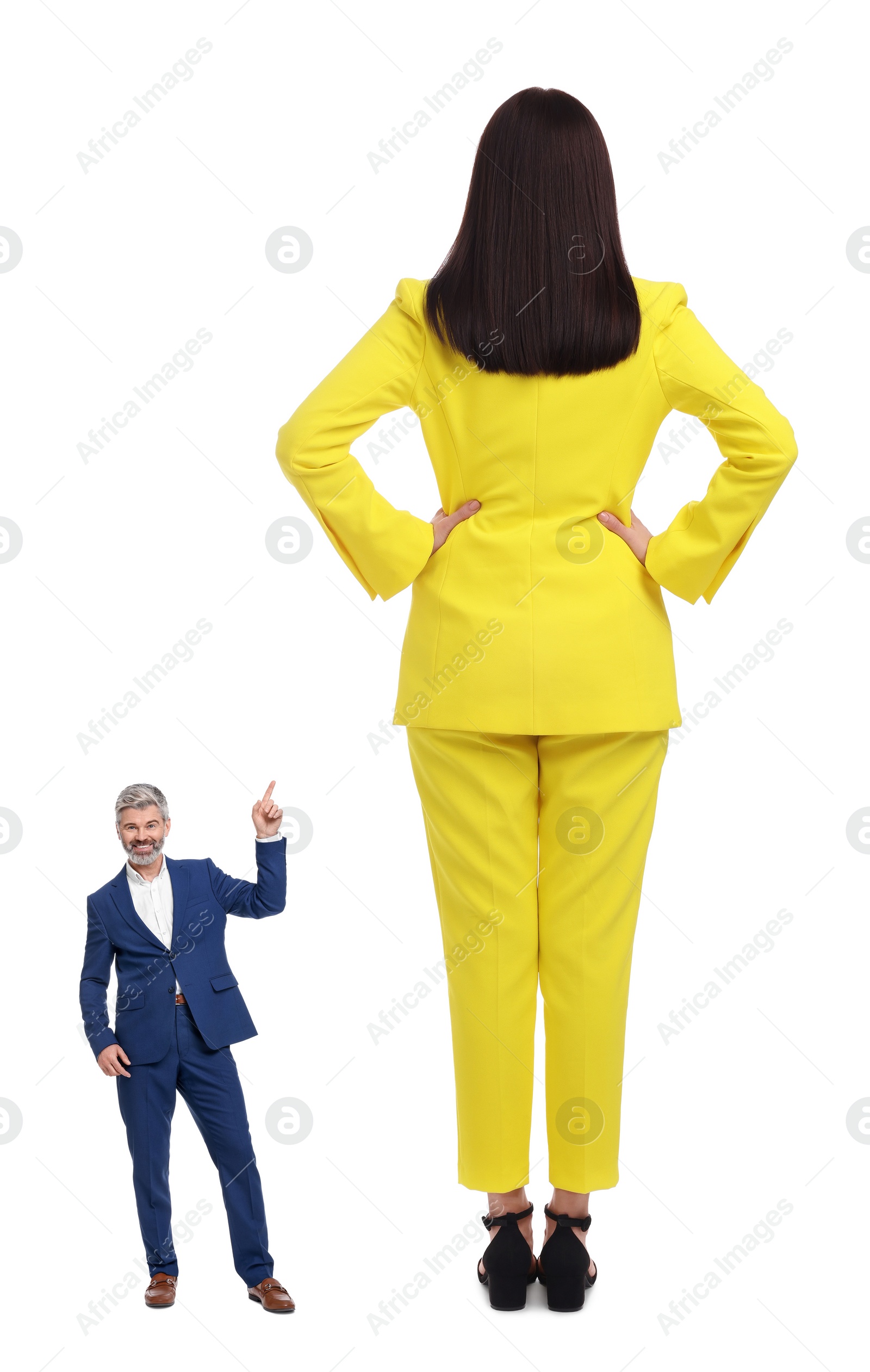 Image of Small man pointing at giant woman on white background