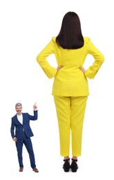 Image of Small man pointing at giant woman on white background