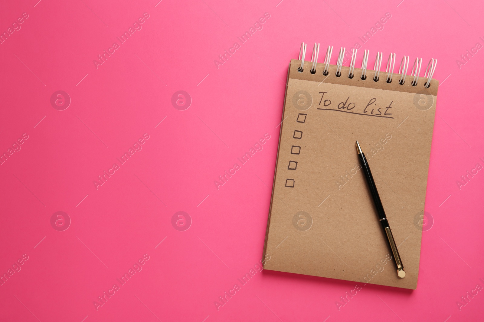 Photo of Notepad with unfilled To Do list and pen on pink background, top view. Space for text