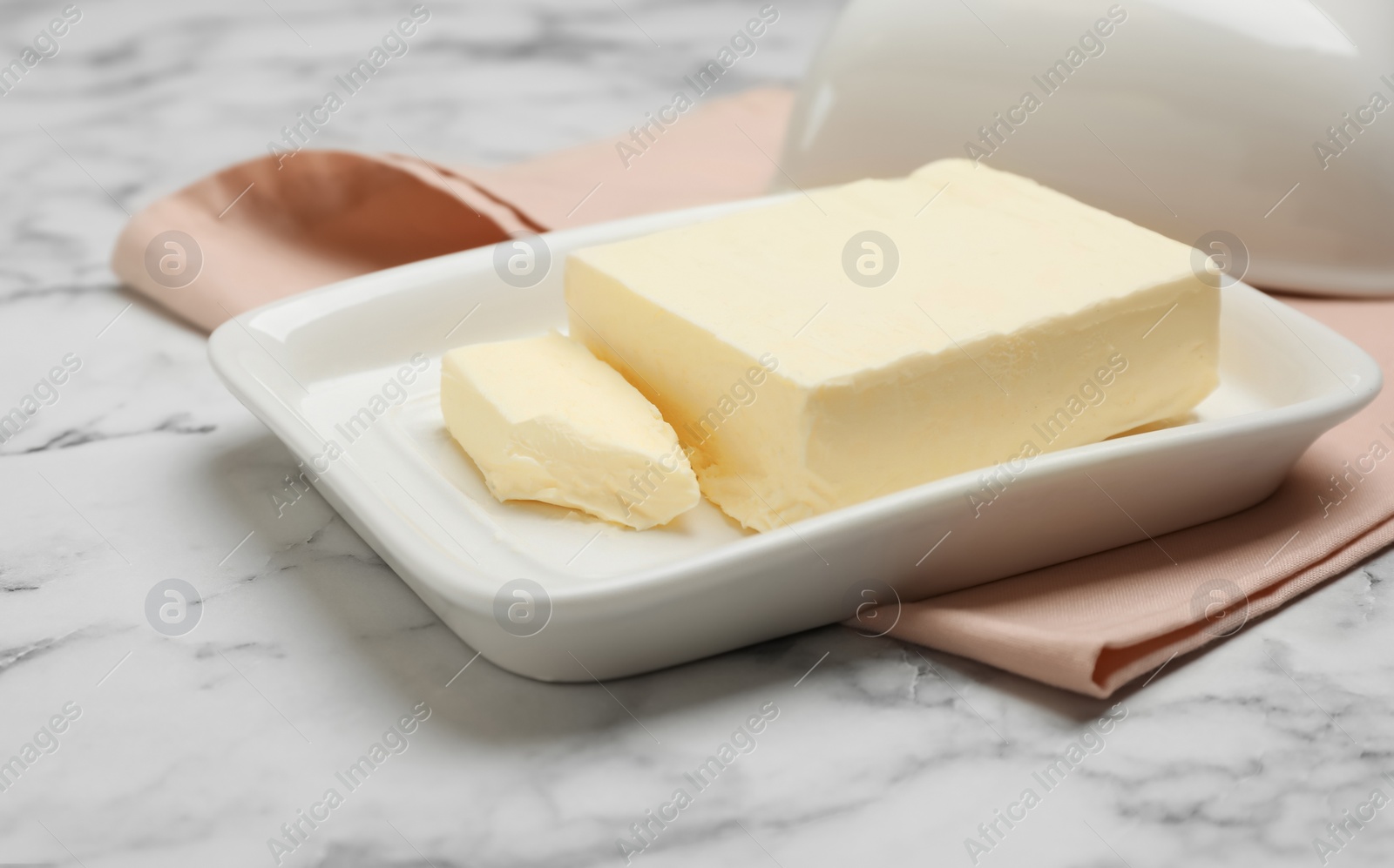 Photo of Plate with tasty fresh butter on table