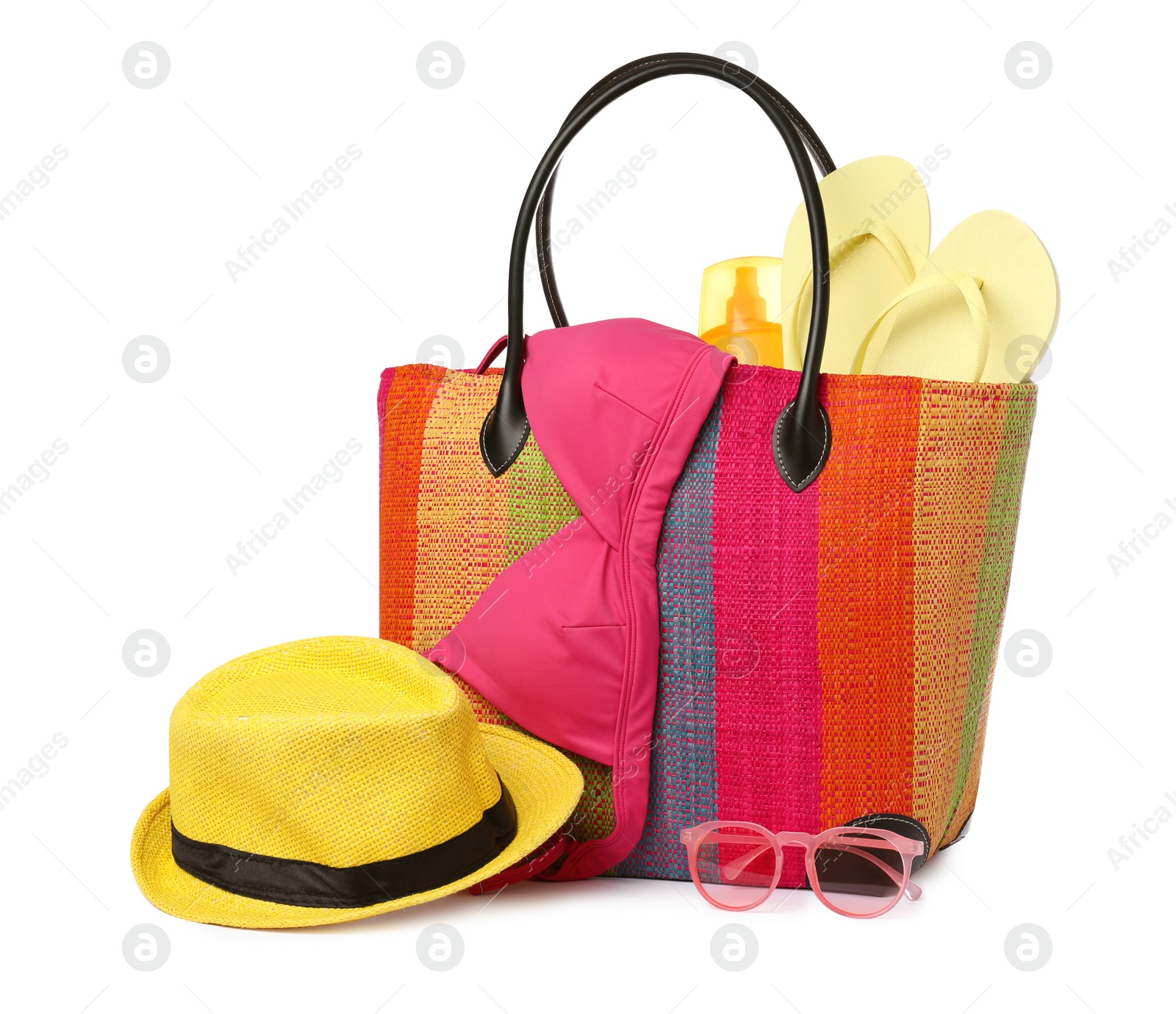 Photo of Stylish bag with beach accessories isolated on white