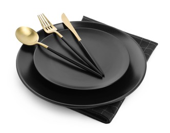 Photo of Black plates with cutlery on white background