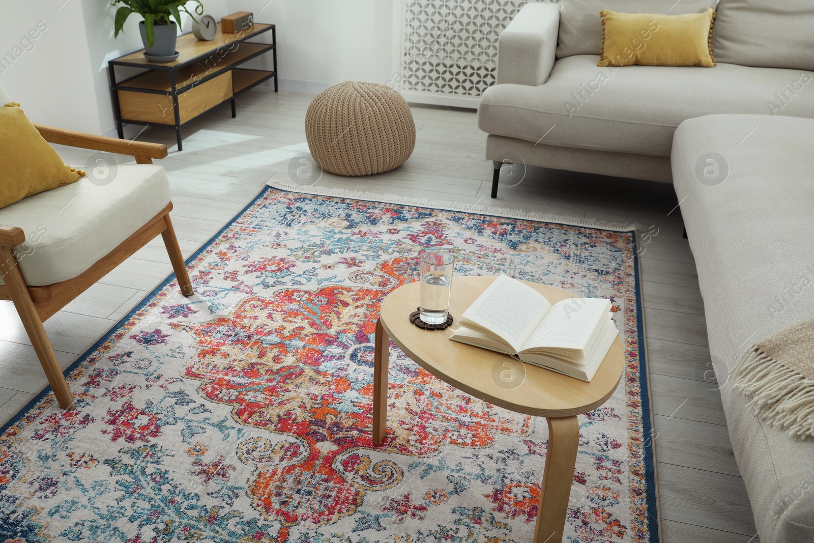 Photo of Stylish living room with beautiful carpet and furniture. Interior design