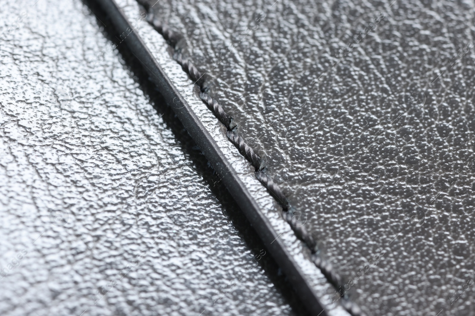 Photo of Beautiful grey leather with seam as background, closeup view