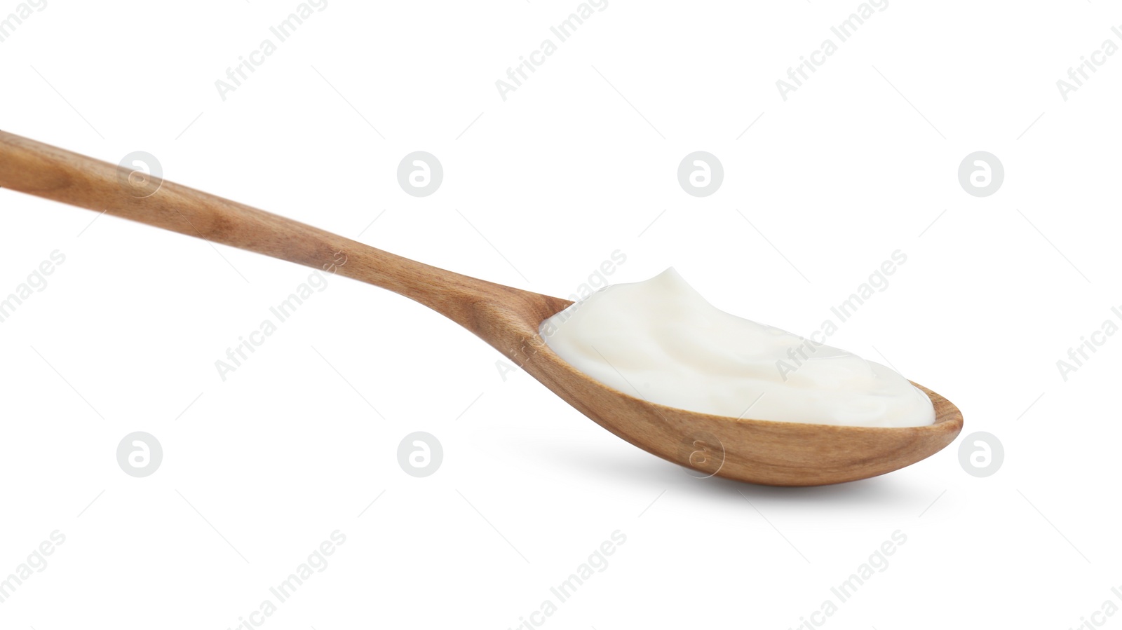 Photo of One wooden spoon with mayonnaise isolated on white