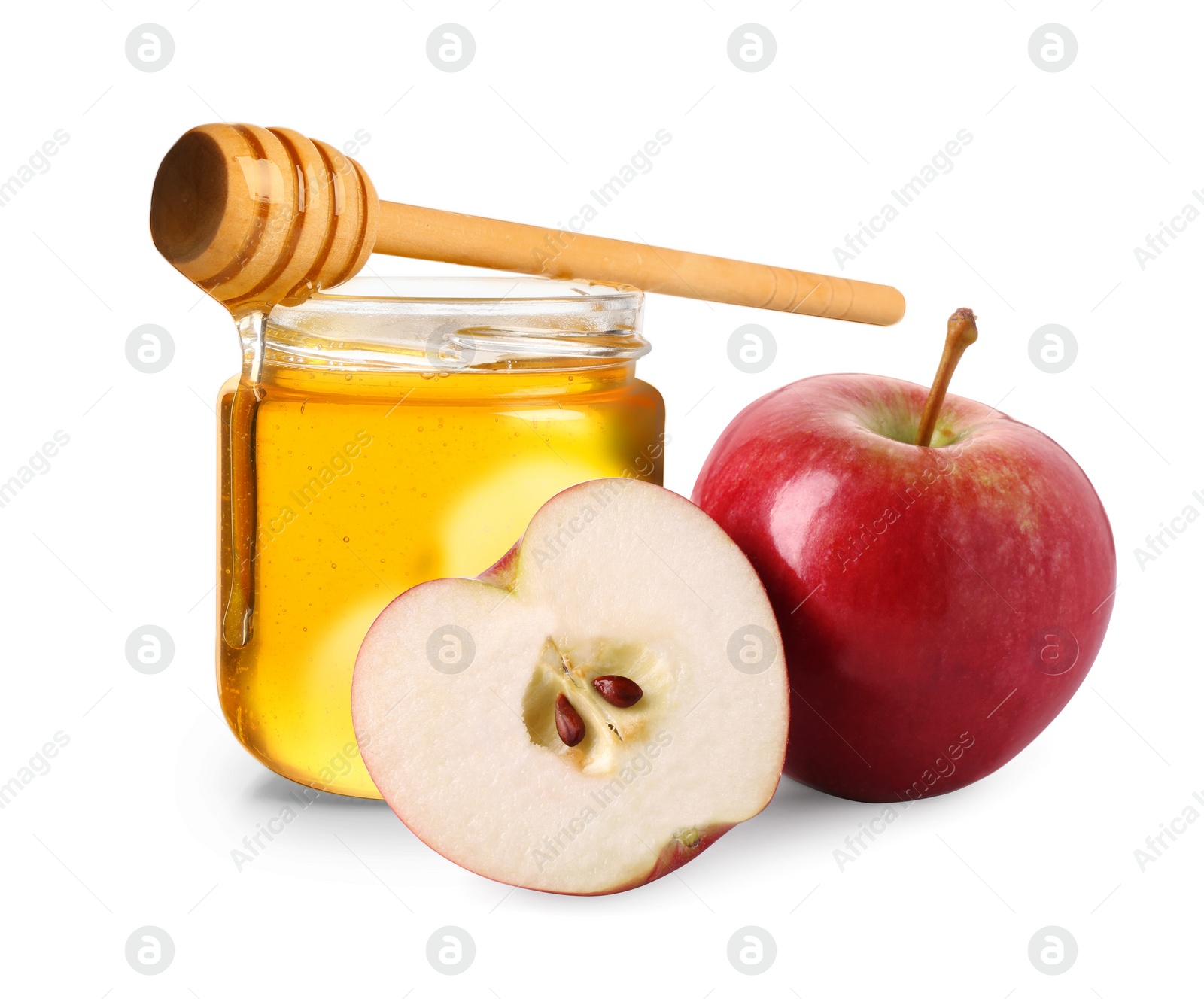 Image of Honey in glass jar, apples and dipper isolated on white