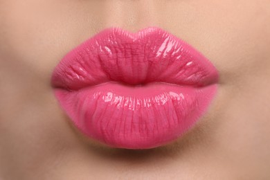 Closeup view of beautiful woman puckering lips for kiss