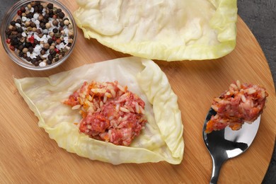 Ingredients for preparing stuffed cabbage rolls on table, flat lay